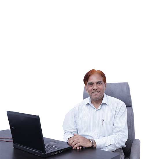 Ihteshamuddin, founder of Talent Zone Academy, sitting at his office desk with a laptop, representing leadership and commitment to education